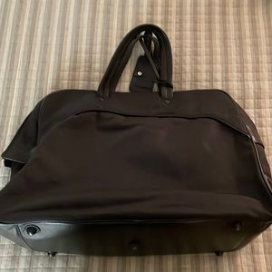 Elegant Carry on bag. Heavy duty black nylon with black leather trim.